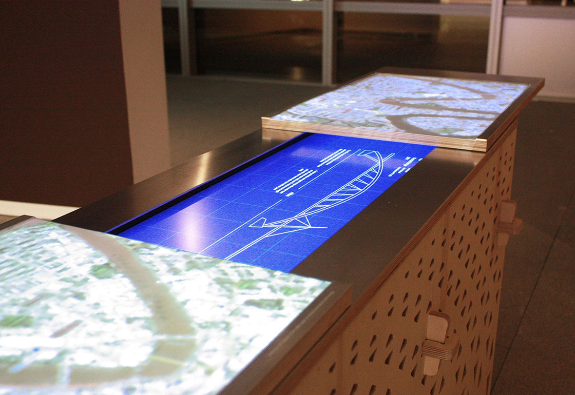 The Arup table being pulled apart to reveal the blueprint beneath