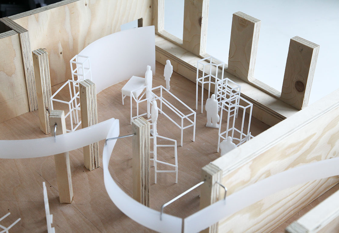 Model with small, white exhibition stands and model people