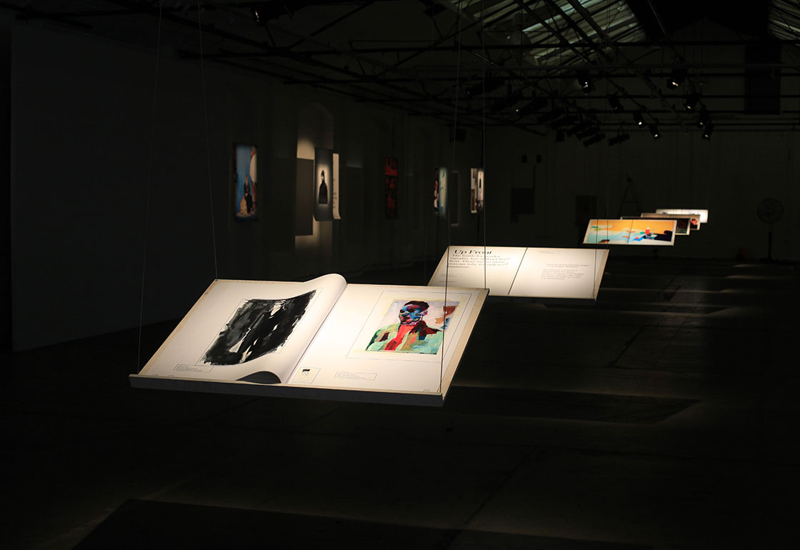 Large books on hanging stands