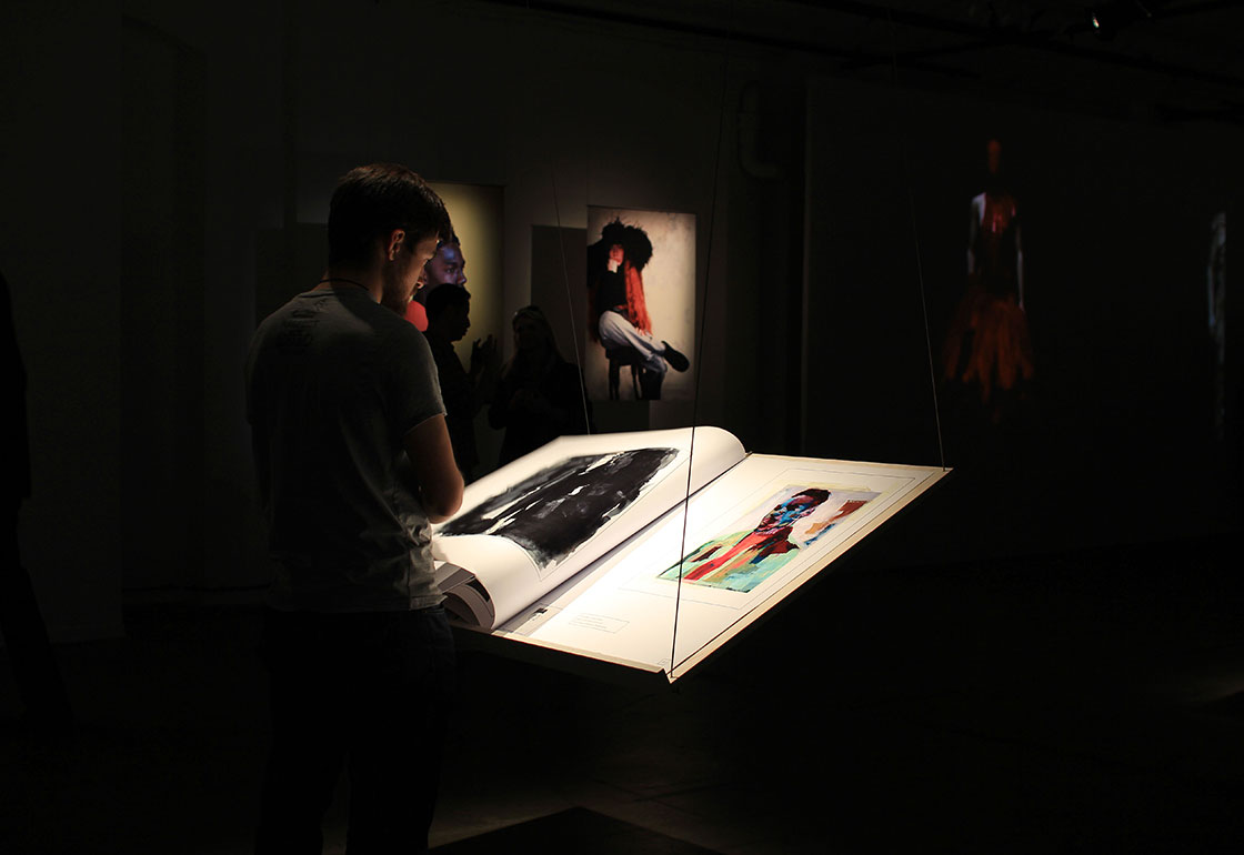 Large books on hanging stands