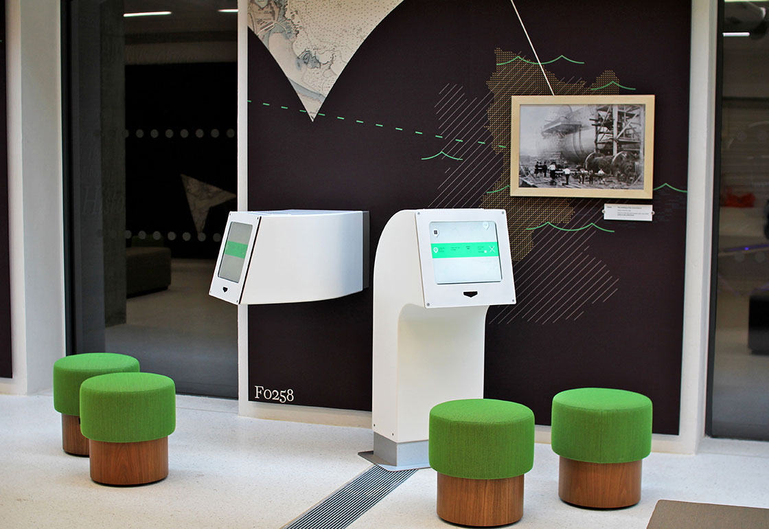 Compass Pods with stools and wall graphics