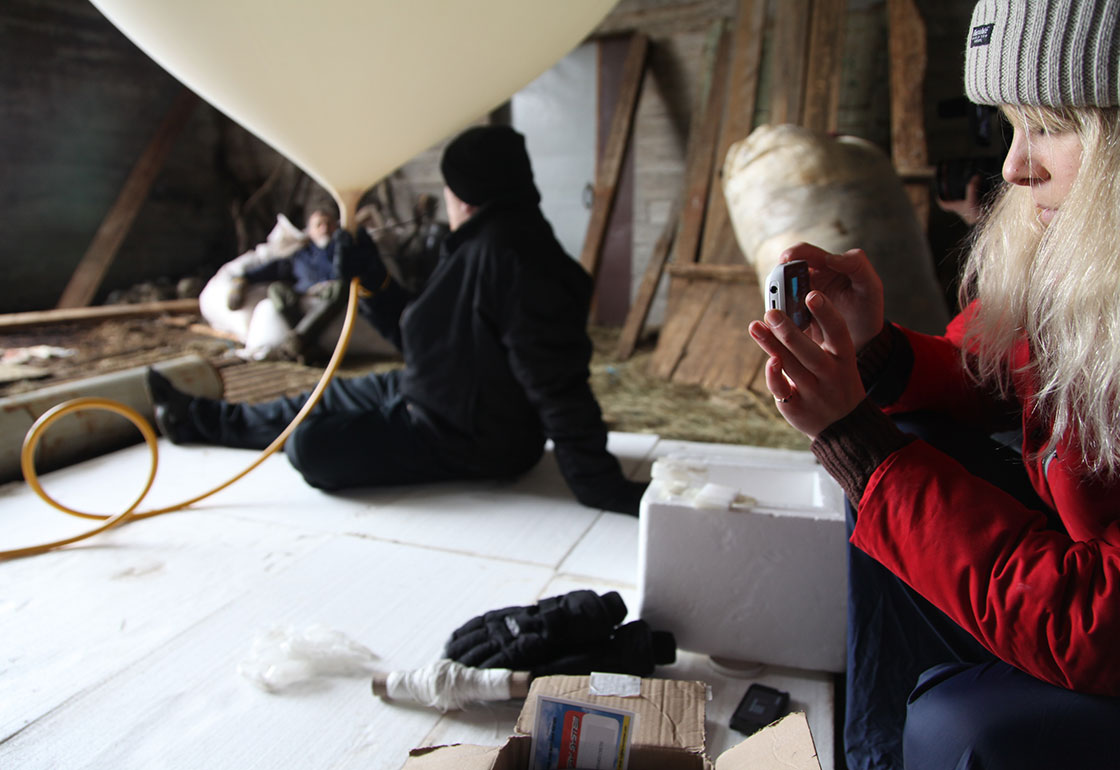 Filling the balloon with air to send the package to space