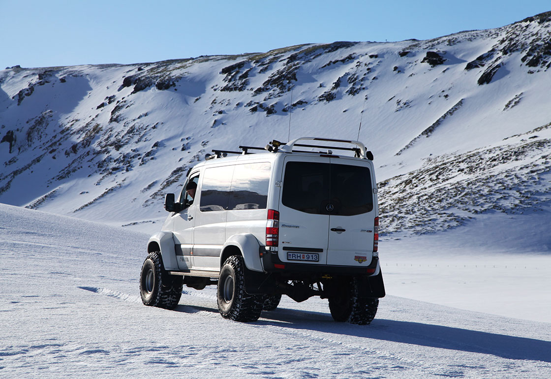A large van in a snowy Icelandic landscape