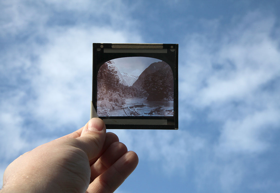 Holding a lantern slide up the light